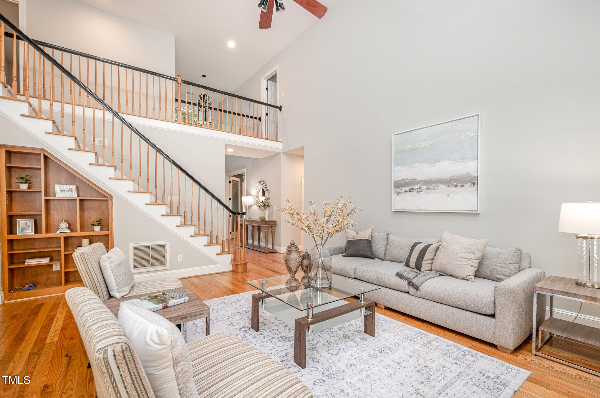 5912 Weather Rock Court Raleigh, NC 27613 - Photo 10 of 50 a living room with furniture or stairs and a wooden floor