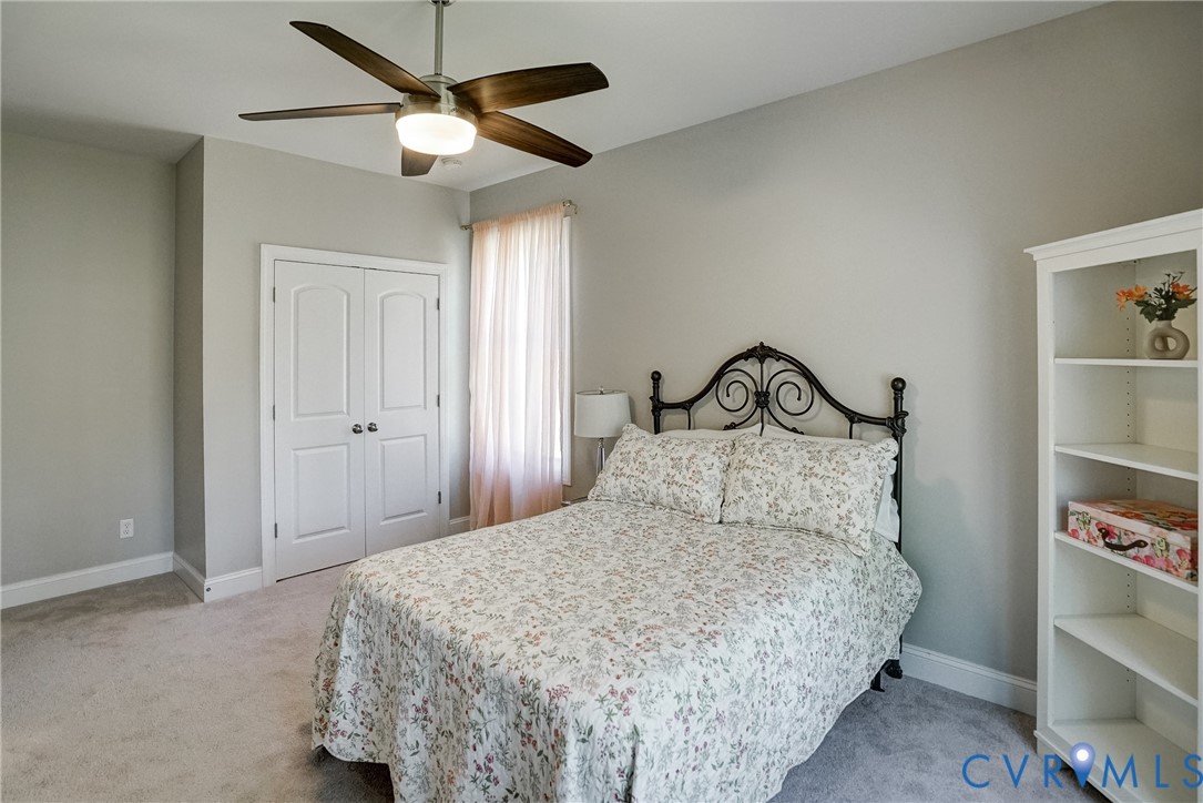 4669 Woburn Road Providence Forge, VA 23140 - Photo 49 of 78 a bedroom with a bed and a ceiling fan