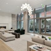5656 San Felipe Street, Unit 1401 Houston, TX 77056 - Photo 1 of 40 a living room with furniture a large window and a chandelier