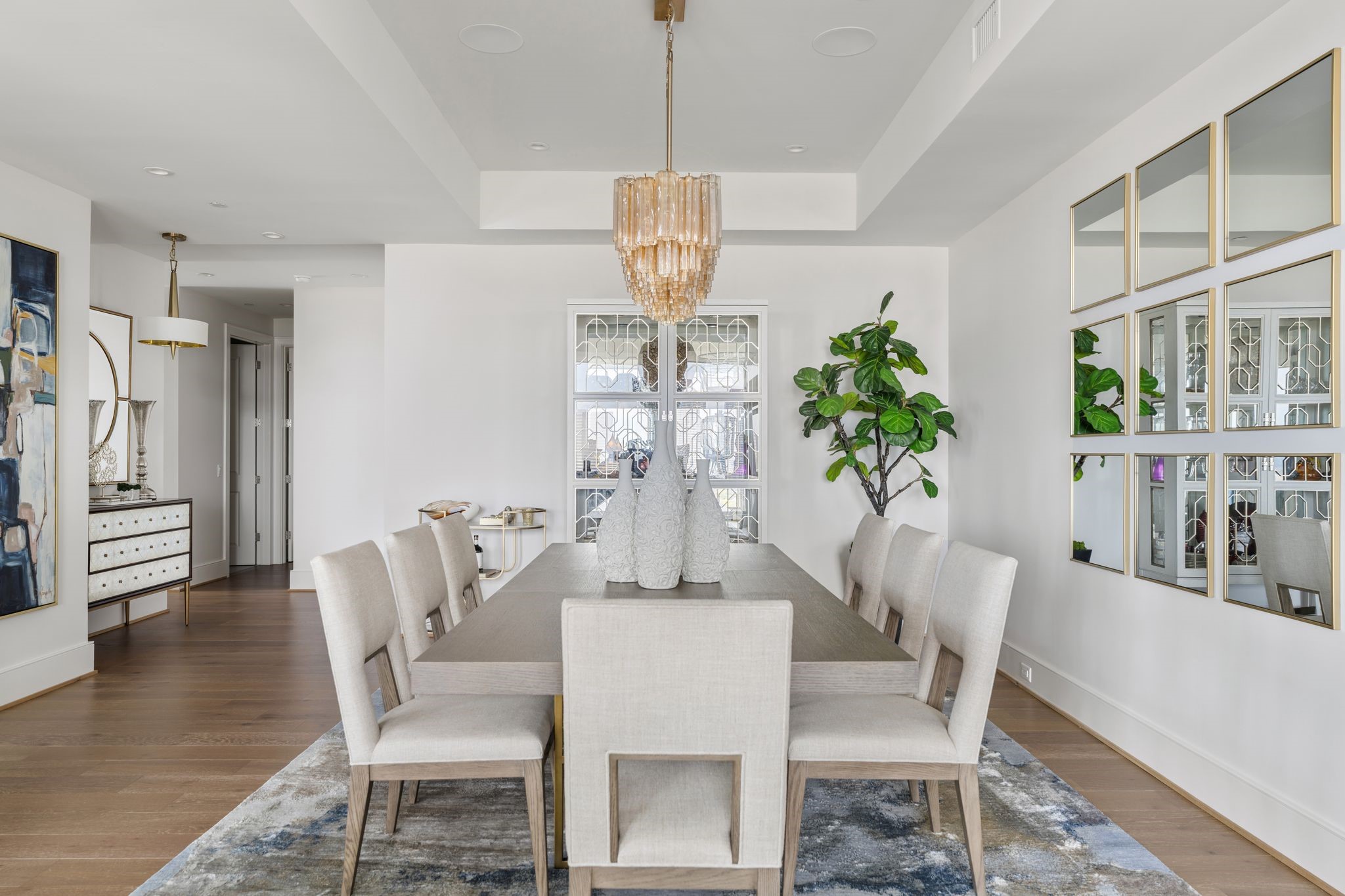 5656 San Felipe Street, Unit 1401 Houston, TX 77056 - Photo 9 of 40 a view of a dining room with furniture window and wooden floor