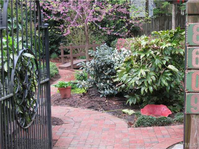 8609 Harbor Drive Raleigh, NC 27615 - Photo 2 of 25 Enter through the side gate....to your very own English garden, gazebo, fountain...and........