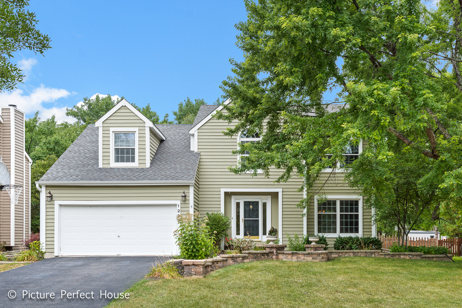 1235 Leverenz Road Naperville, IL 60564 - Photo 1 of 25 a front view of a house with a garden and yard