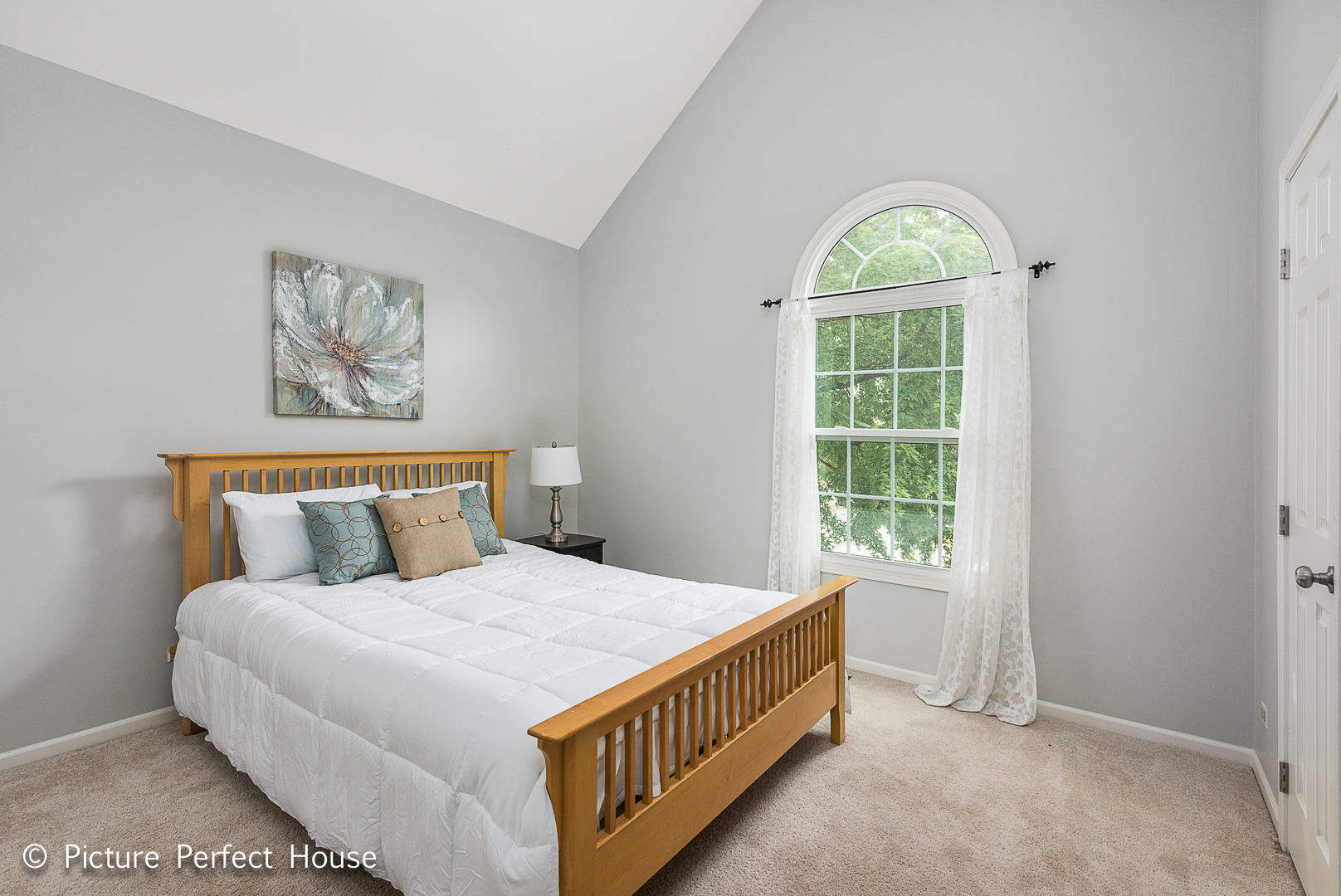 1235 Leverenz Road Naperville, IL 60564 - Photo 14 of 25 a bed sitting in a bedroom next to a window