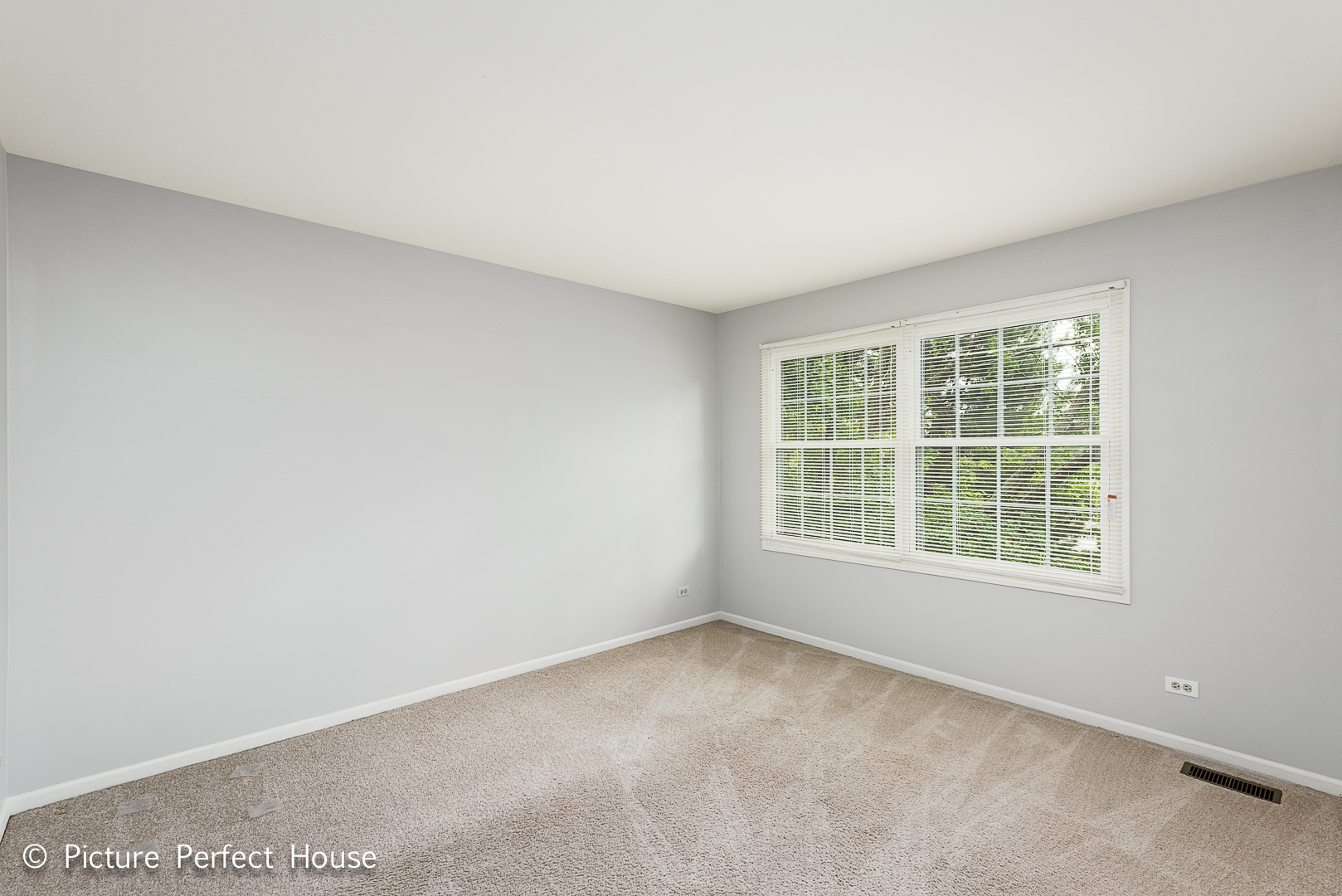 1235 Leverenz Road Naperville, IL 60564 - Photo 16 of 25 an empty room with a window