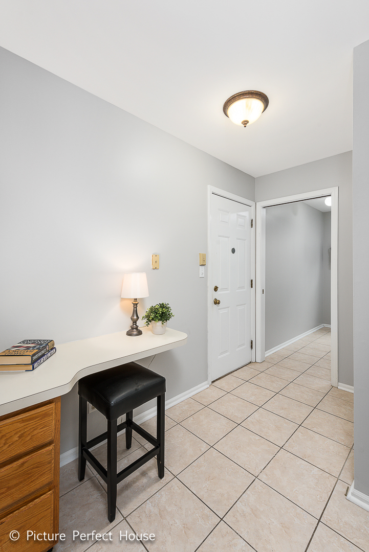 1235 Leverenz Road Naperville, IL 60564 - Photo 18 of 25 a room that has a dresser and a chair in it