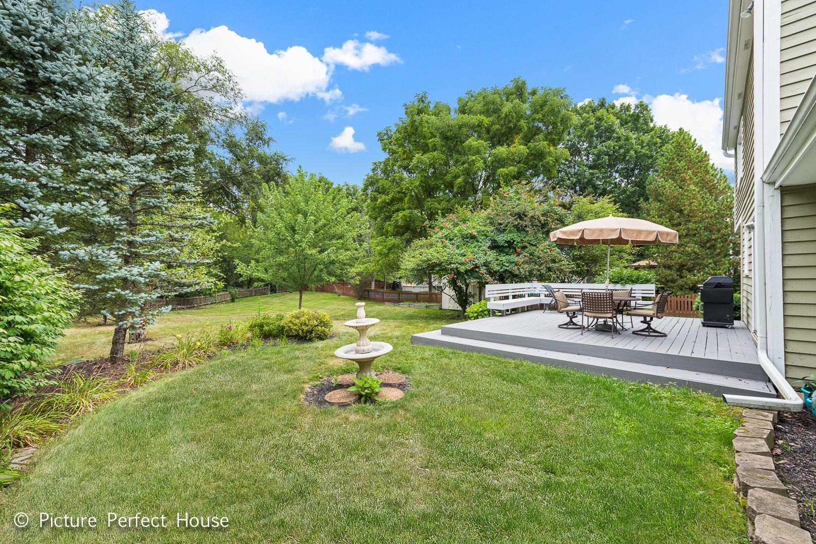 1235 Leverenz Road Naperville, IL 60564 - Photo 21 of 25 a view of a chair and table on the garden