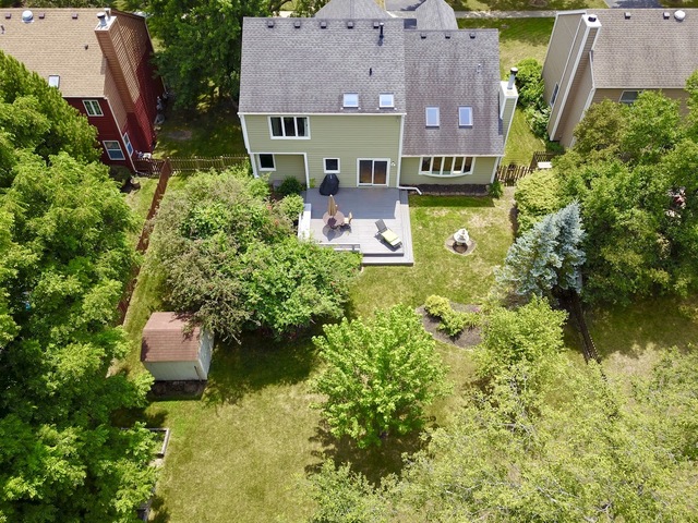 1235 Leverenz Road Naperville, IL 60564 - Photo 24 of 25 an aerial view of a house with garden space and a lake view