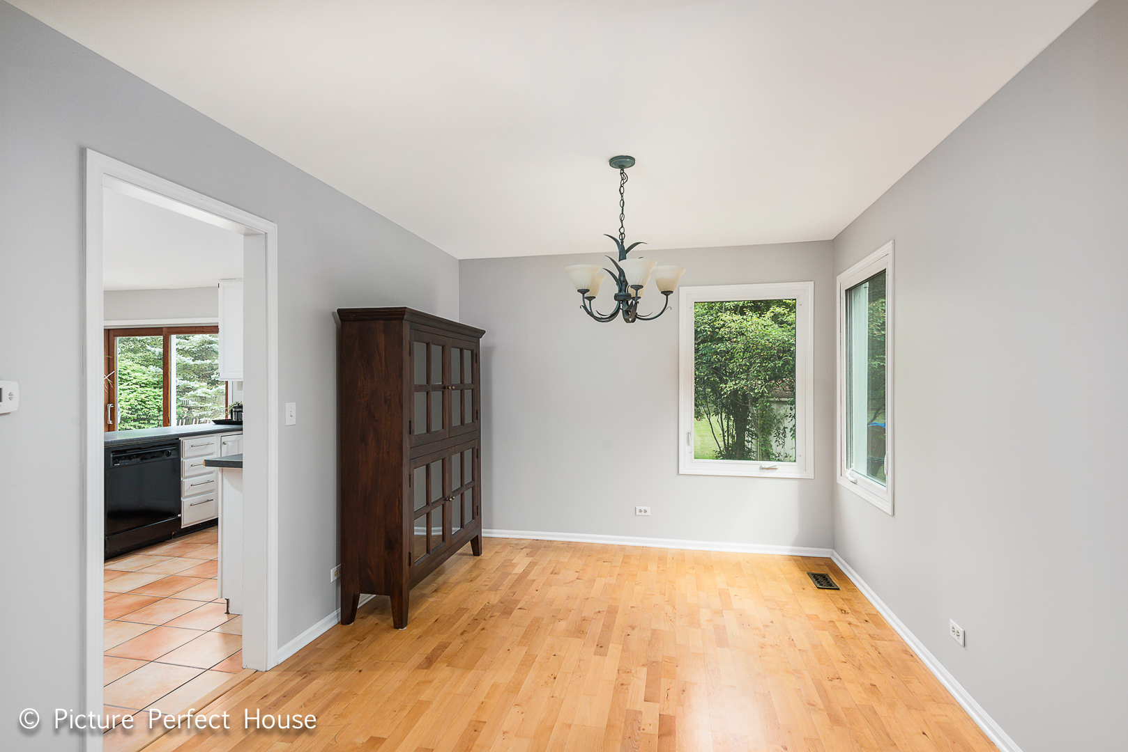 1235 Leverenz Road Naperville, IL 60564 - Photo 8 of 25 a view of an empty room with a window
