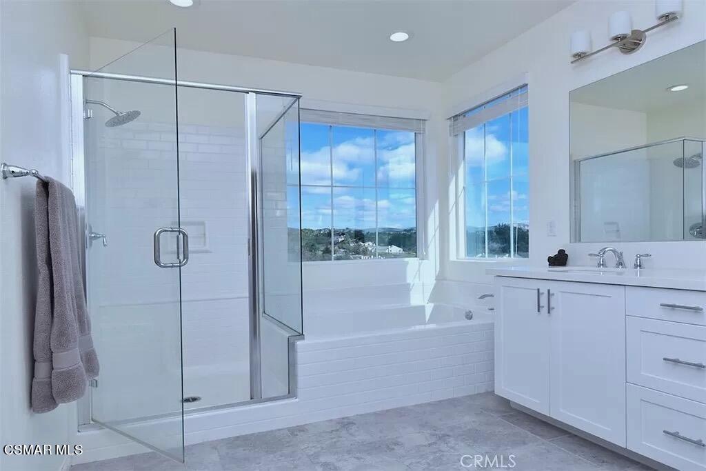 207 Morro Way, Unit 3 Simi Valley, CA 93065 - Photo 24 of 31 a bathroom with a tub sink and mirror