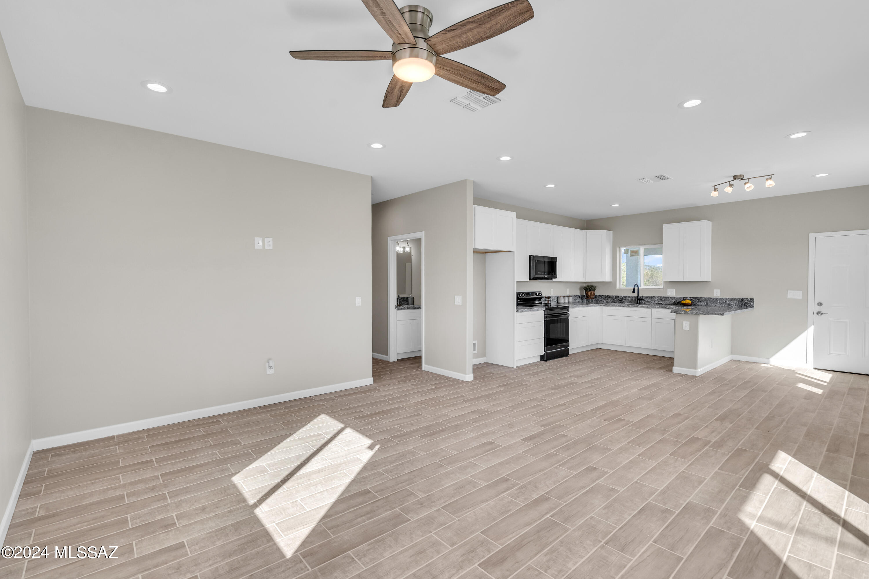 103 Headge Court Rio Rico, AZ 85648 - Photo 11 of 35 a view of kitchen with stainless steel appliances refrigerator oven microwave and cabinets