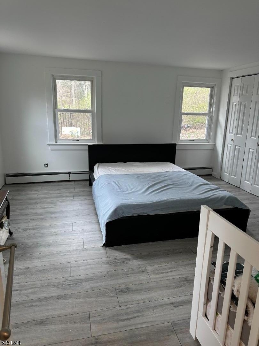 213 Liberty Corner Road Bernards, NJ 07931 - Photo 12 of 24 a bedroom with a bed and a window