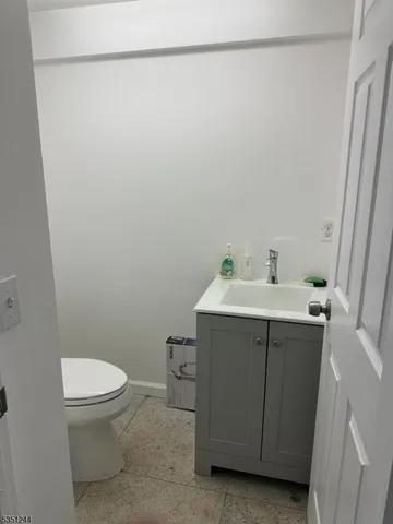 a bathroom with a sink a toilet and a shower