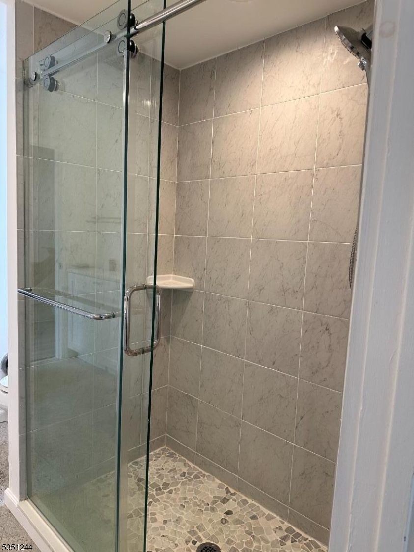 213 Liberty Corner Road Bernards, NJ 07931 - Photo 9 of 24 a bathroom with a glass shower door
