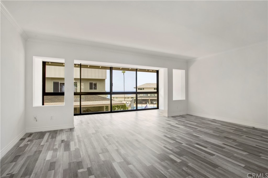 3 Blue Lagoon Laguna Beach, CA 92651 - Photo 15 of 32 wooden floor in an empty room with a window