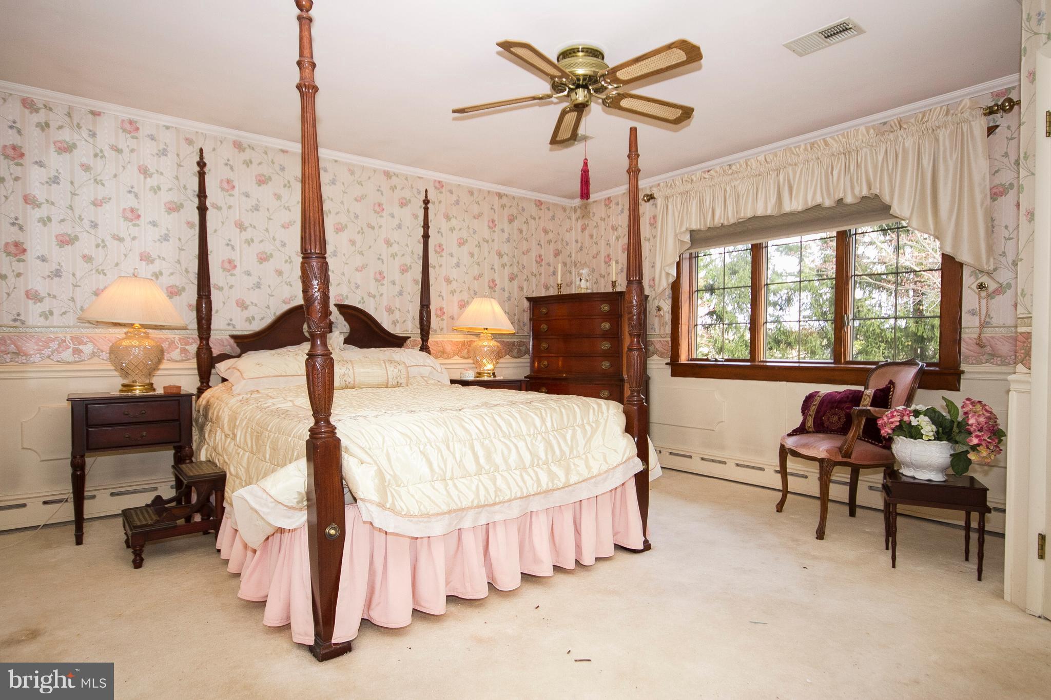 4009 Klausmier Road Baltimore, MD 21236 - Photo 13 of 24 a bedroom with a bed a chair and a large window