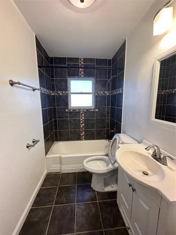 a bathroom with a sink toilet a shower and a mirror