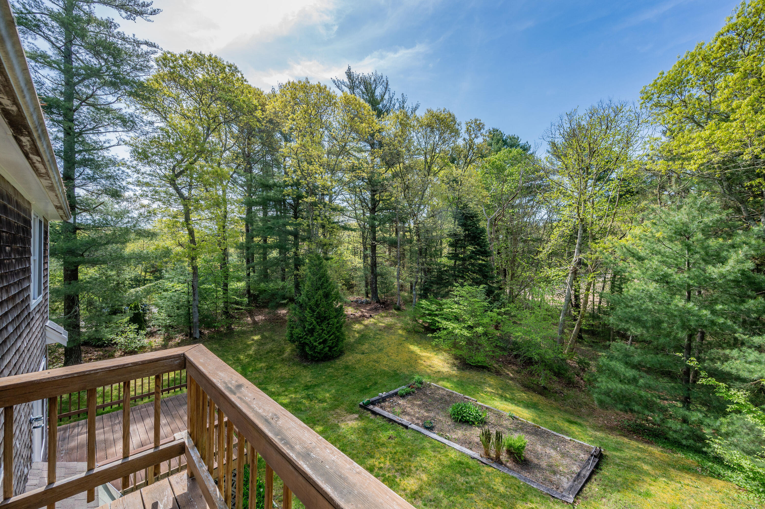 80 J B Drive Marstons Mills, MA 02648 - Photo 18 of 27 a view of a balcony with trees