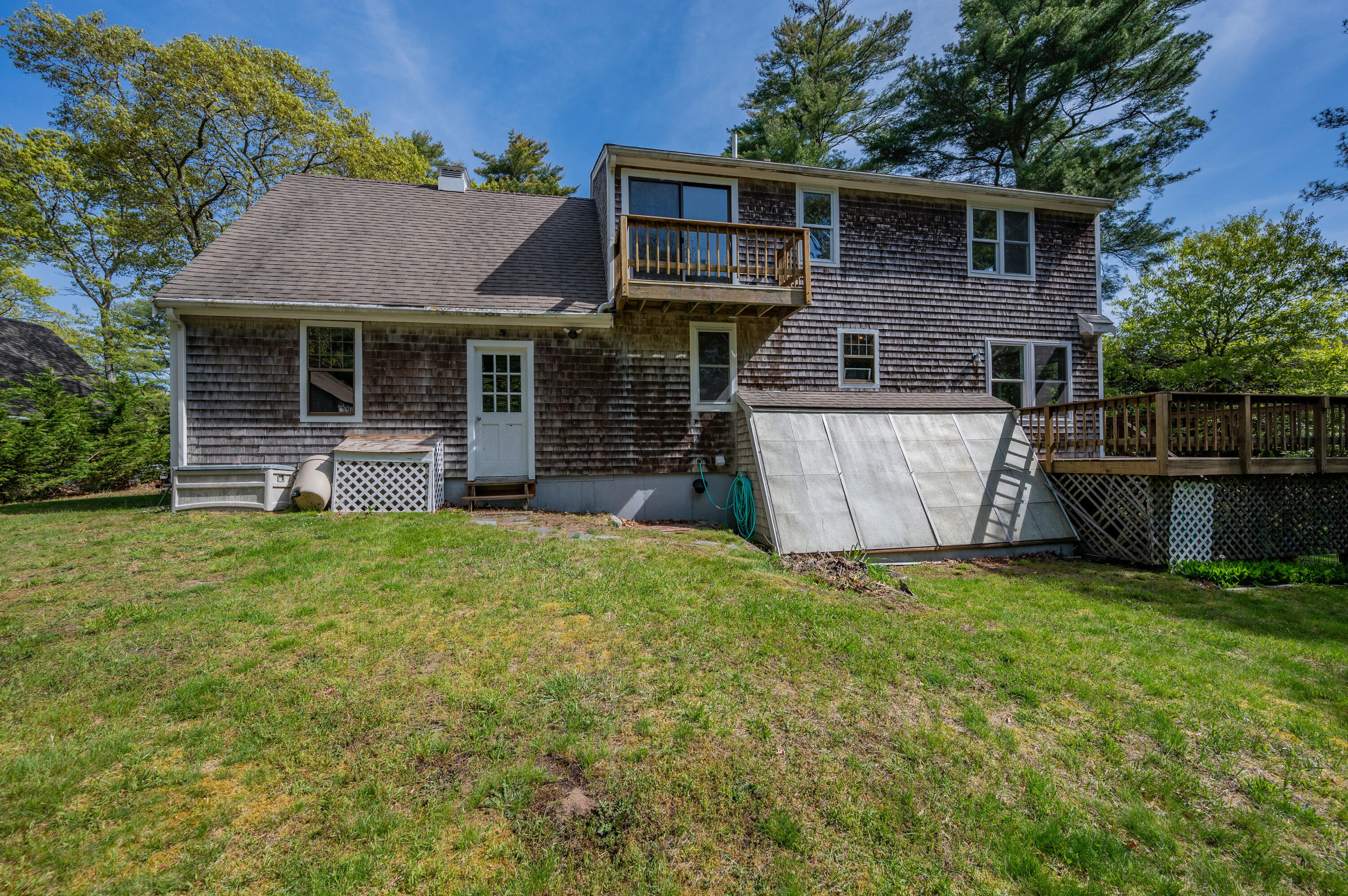80 J B Drive Marstons Mills, MA 02648 - Photo 19 of 27 a front view of a house with a yard