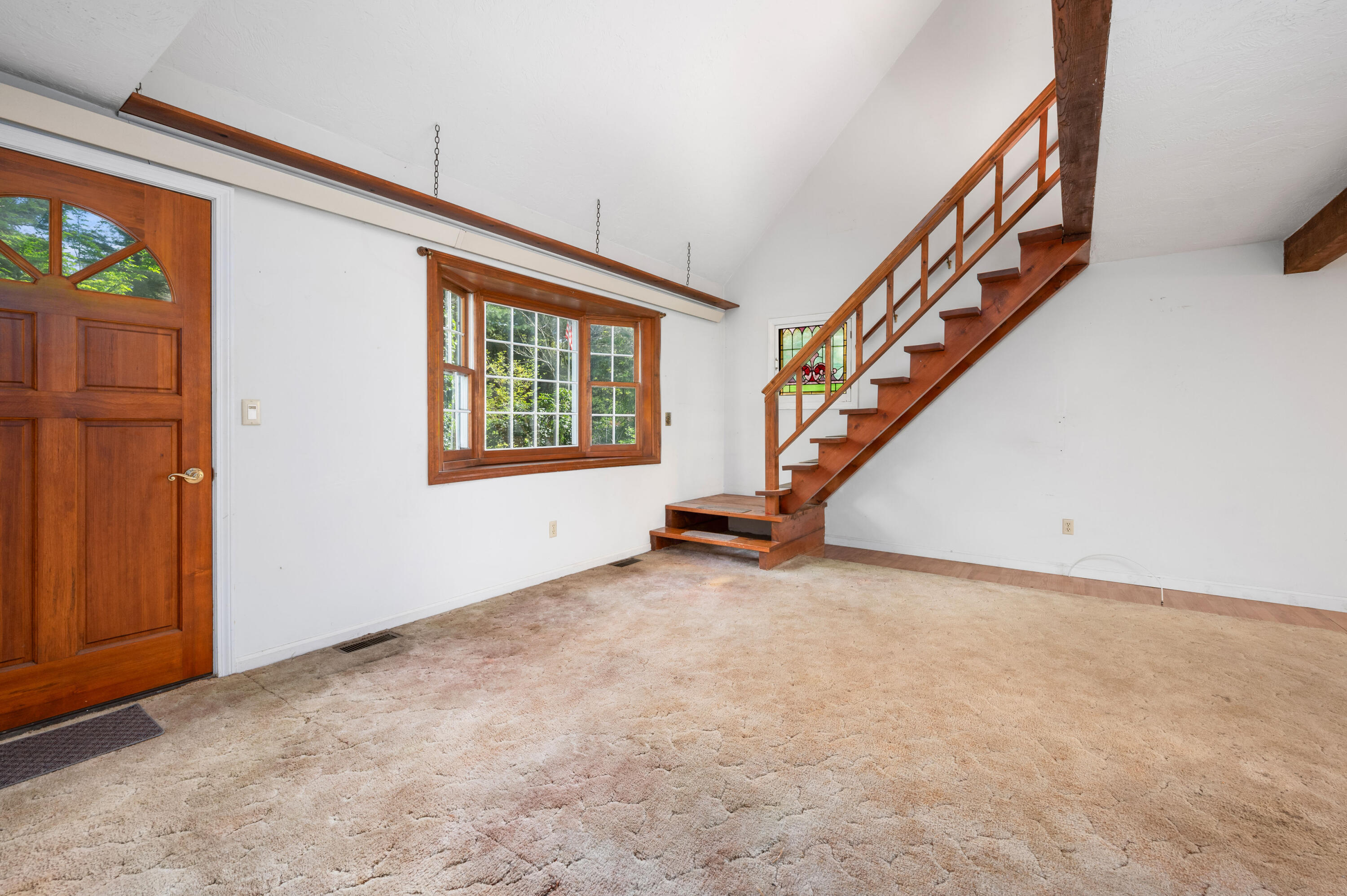 80 J B Drive Marstons Mills, MA 02648 - Photo 2 of 27 an empty room with stairs and windows