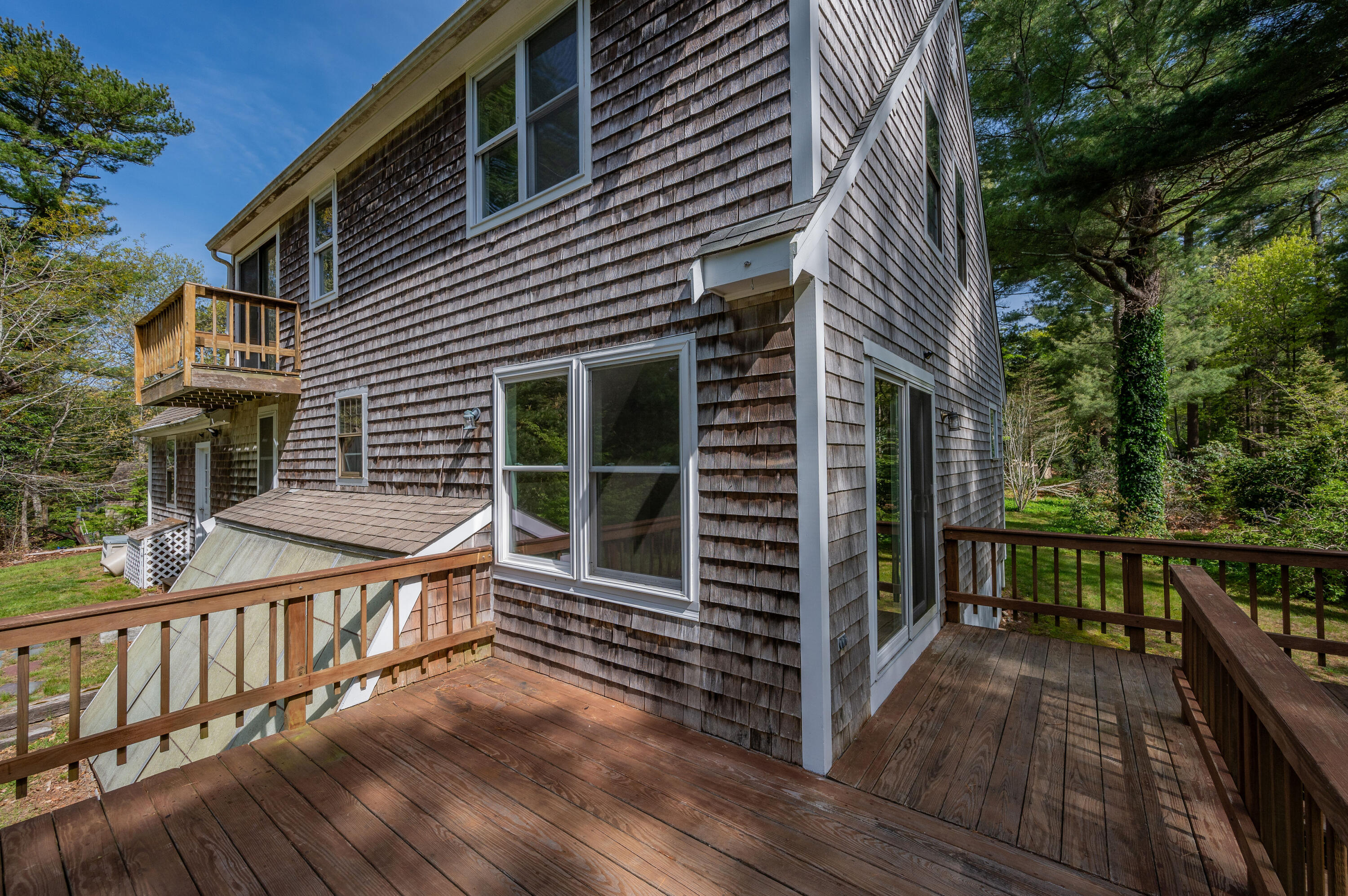 80 J B Drive Marstons Mills, MA 02648 - Photo 21 of 27 a view of house with deck and outdoor seating