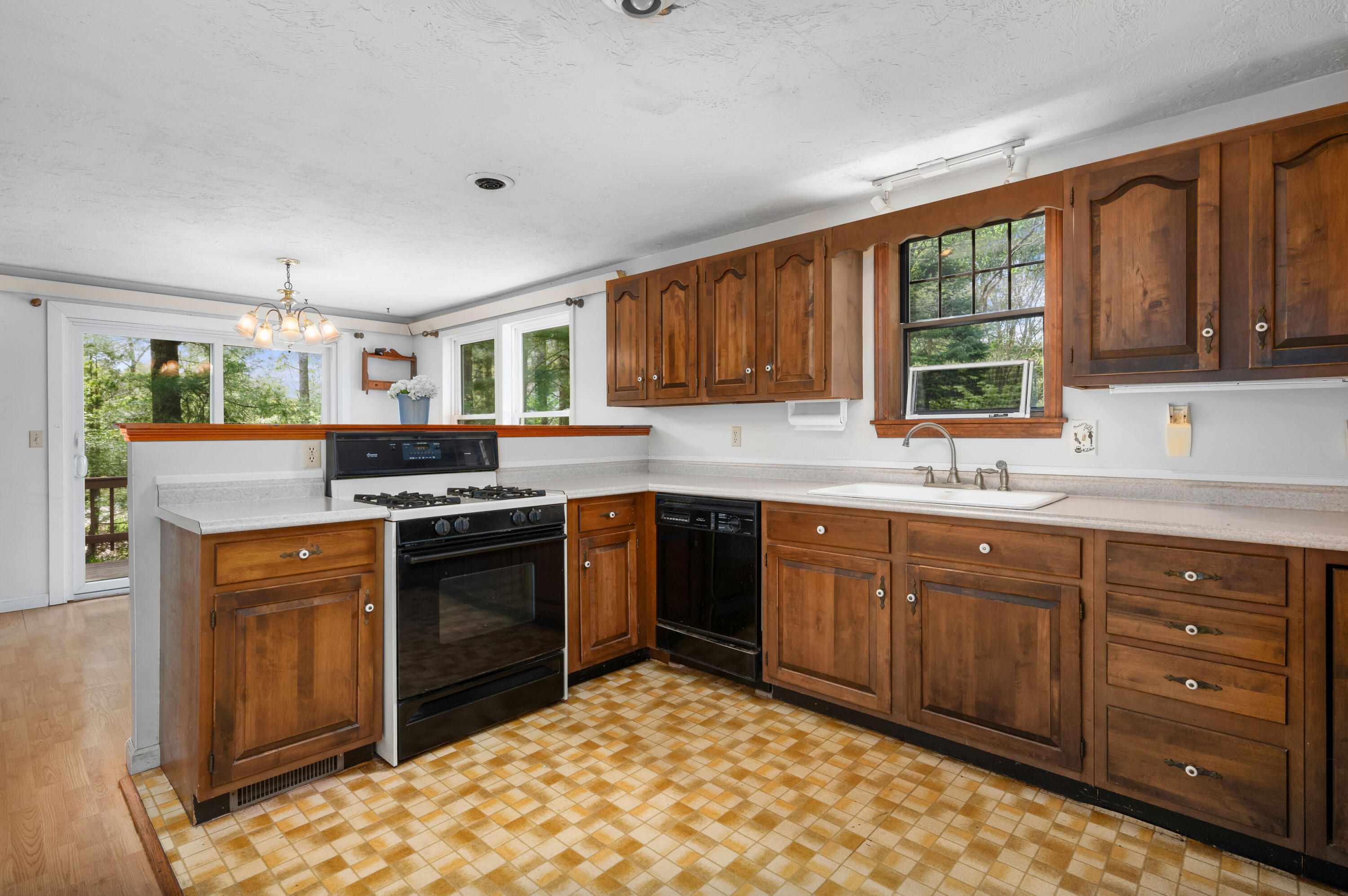 80 J B Drive Marstons Mills, MA 02648 - Photo 7 of 27 a kitchen with stainless steel appliances granite countertop a stove sink and cabinets