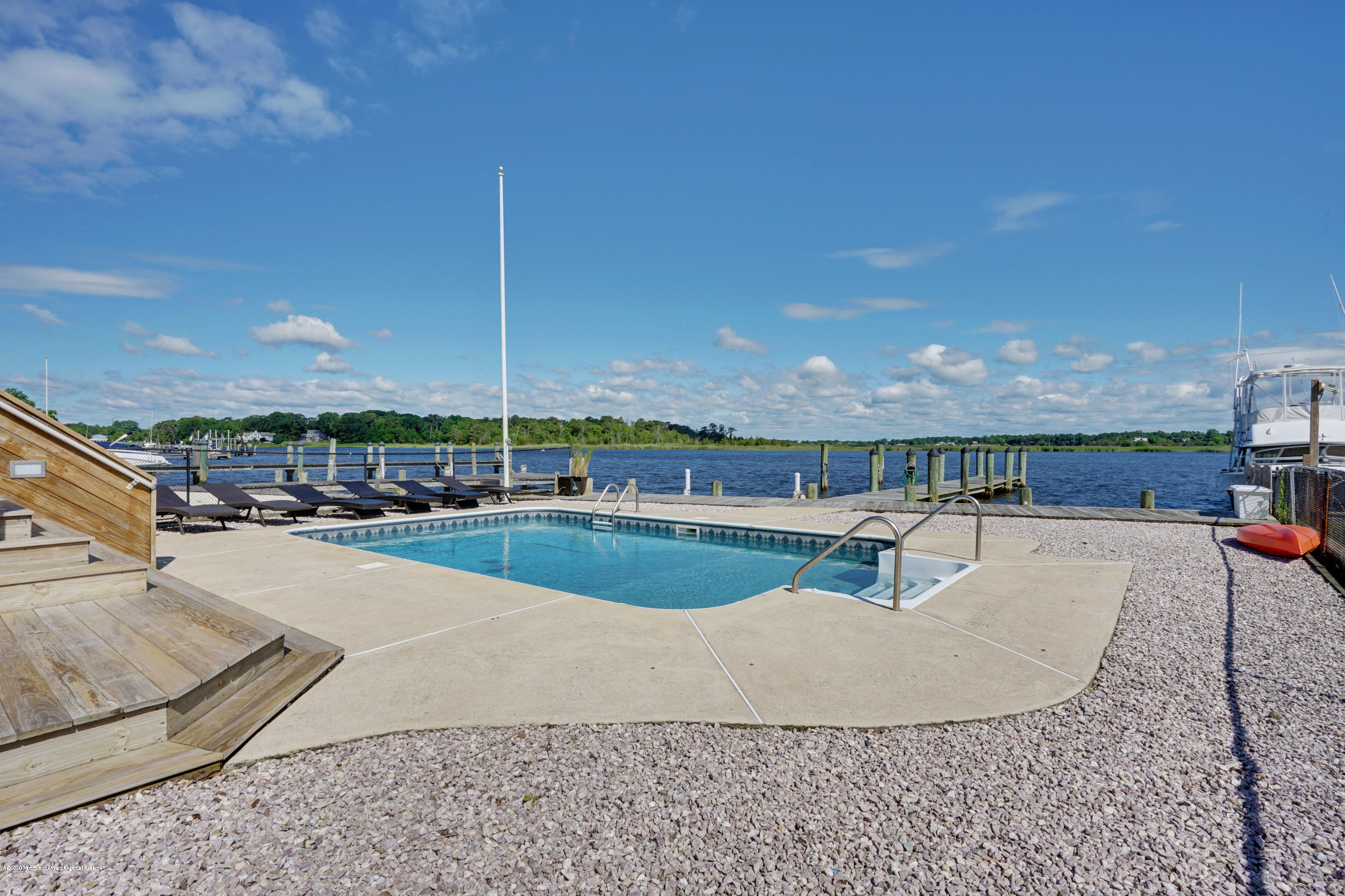11 Metedeconk Road Brick, NJ 08723 - Photo 1 of 99 a view of a swimming pool with a patio