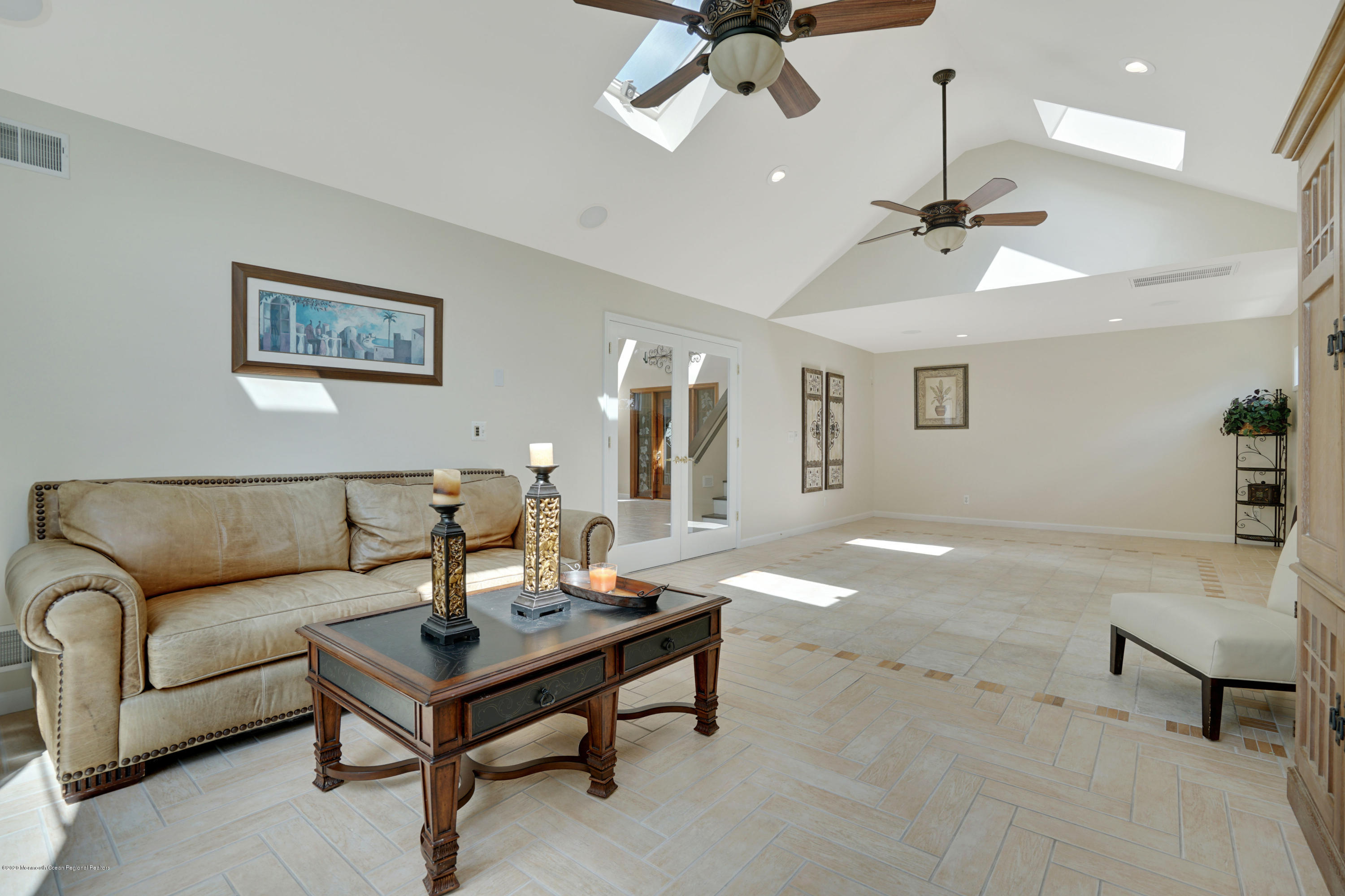 11 Metedeconk Road Brick, NJ 08723 - Photo 12 of 99 a living room with furniture and a ceiling fan