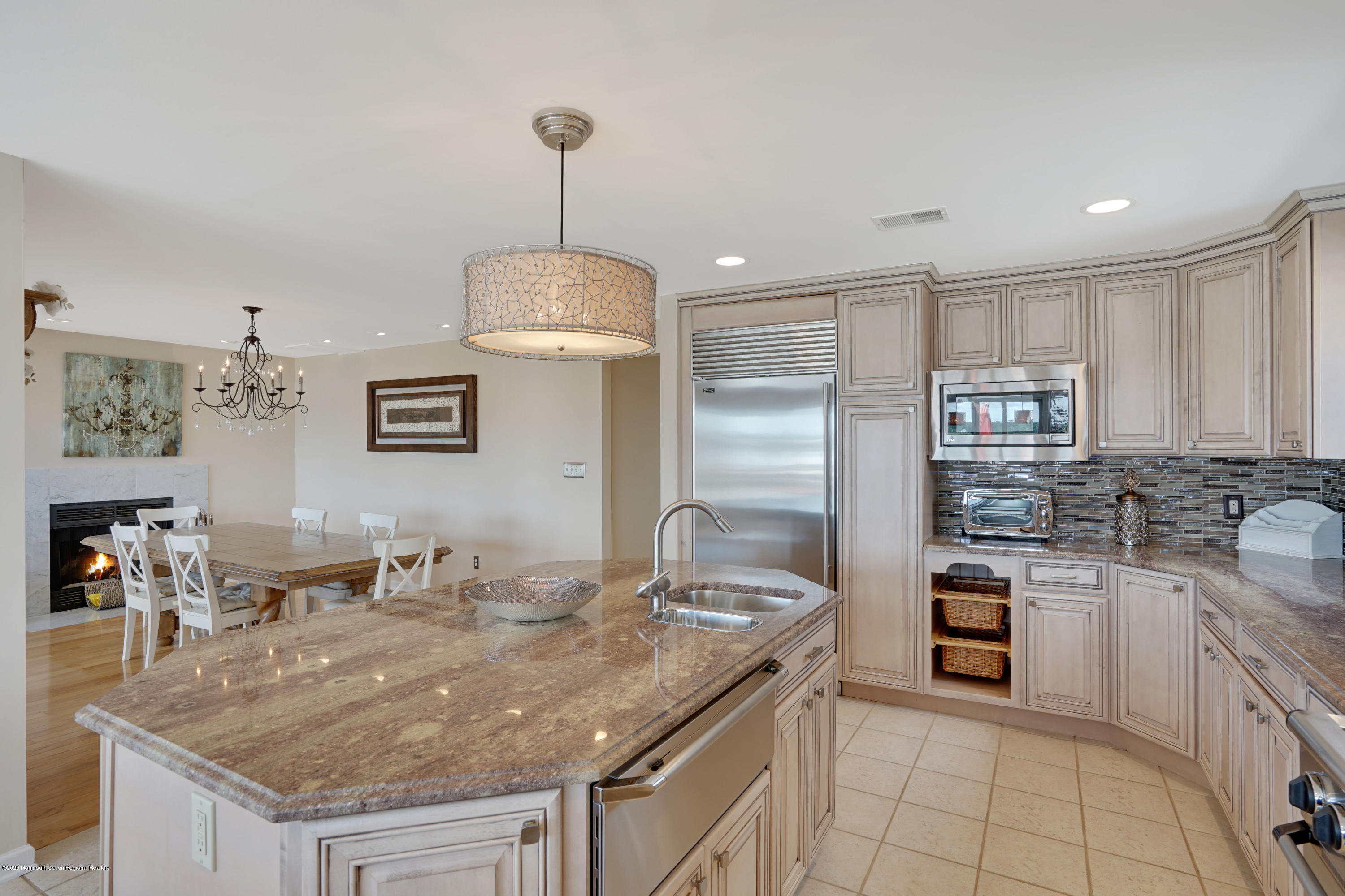 11 Metedeconk Road Brick, NJ 08723 - Photo 18 of 99 a kitchen with stainless steel appliances granite countertop a sink a stove and a refrigerator