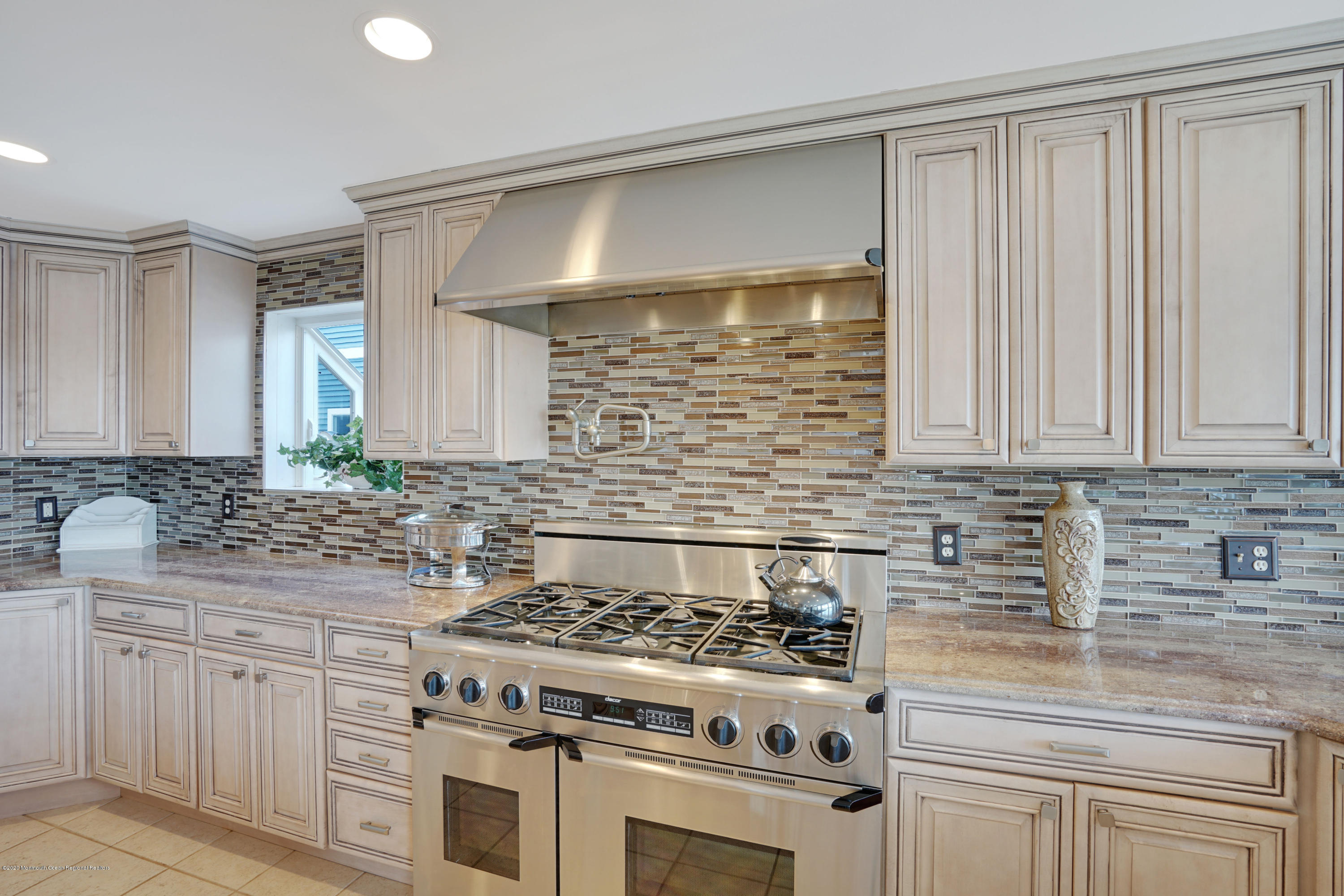 11 Metedeconk Road Brick, NJ 08723 - Photo 21 of 99 a kitchen with granite countertop a stove sink and cabinets