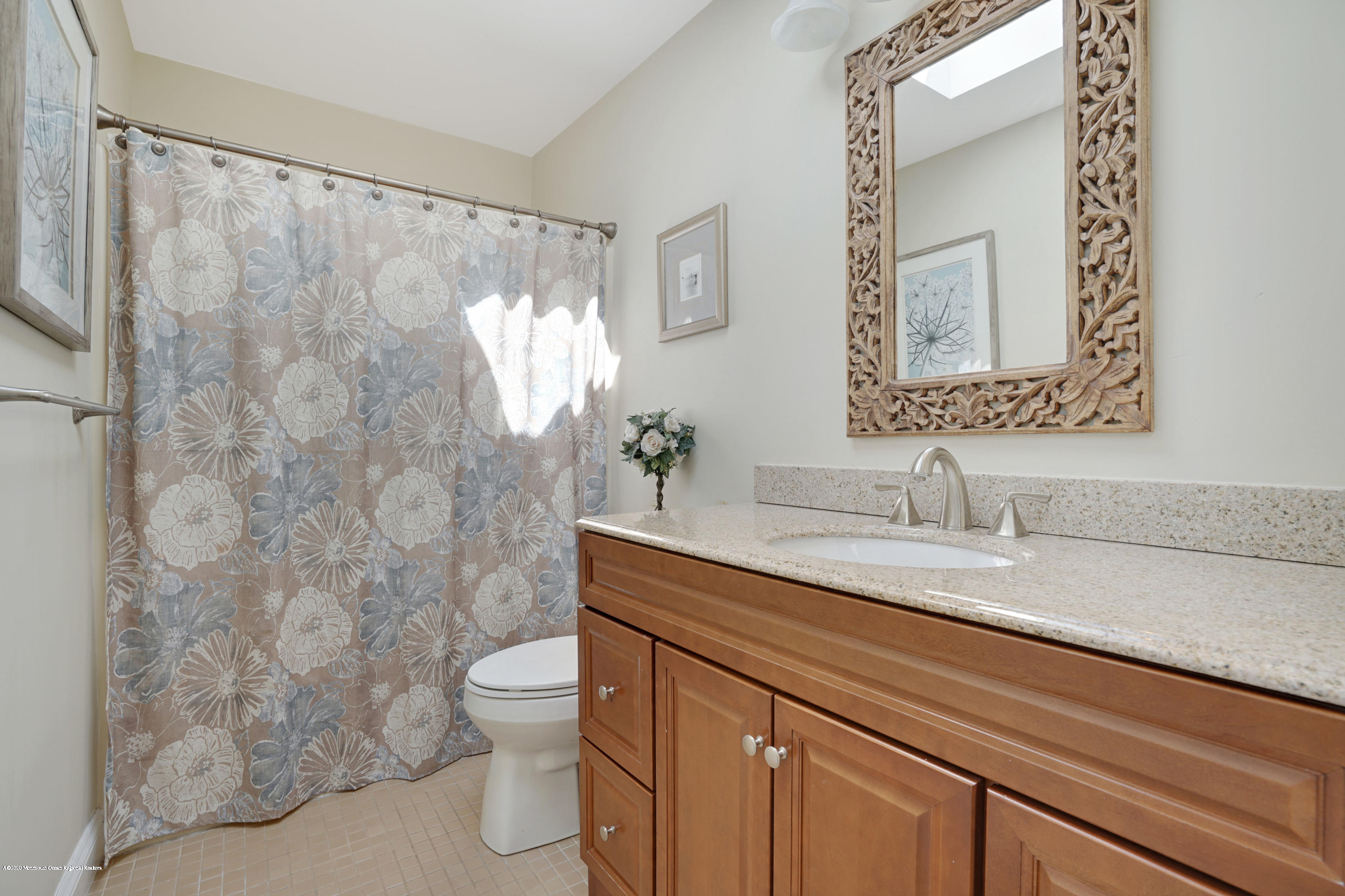 11 Metedeconk Road Brick, NJ 08723 - Photo 40 of 99 a bathroom with a granite countertop sink a toilet and a mirror
