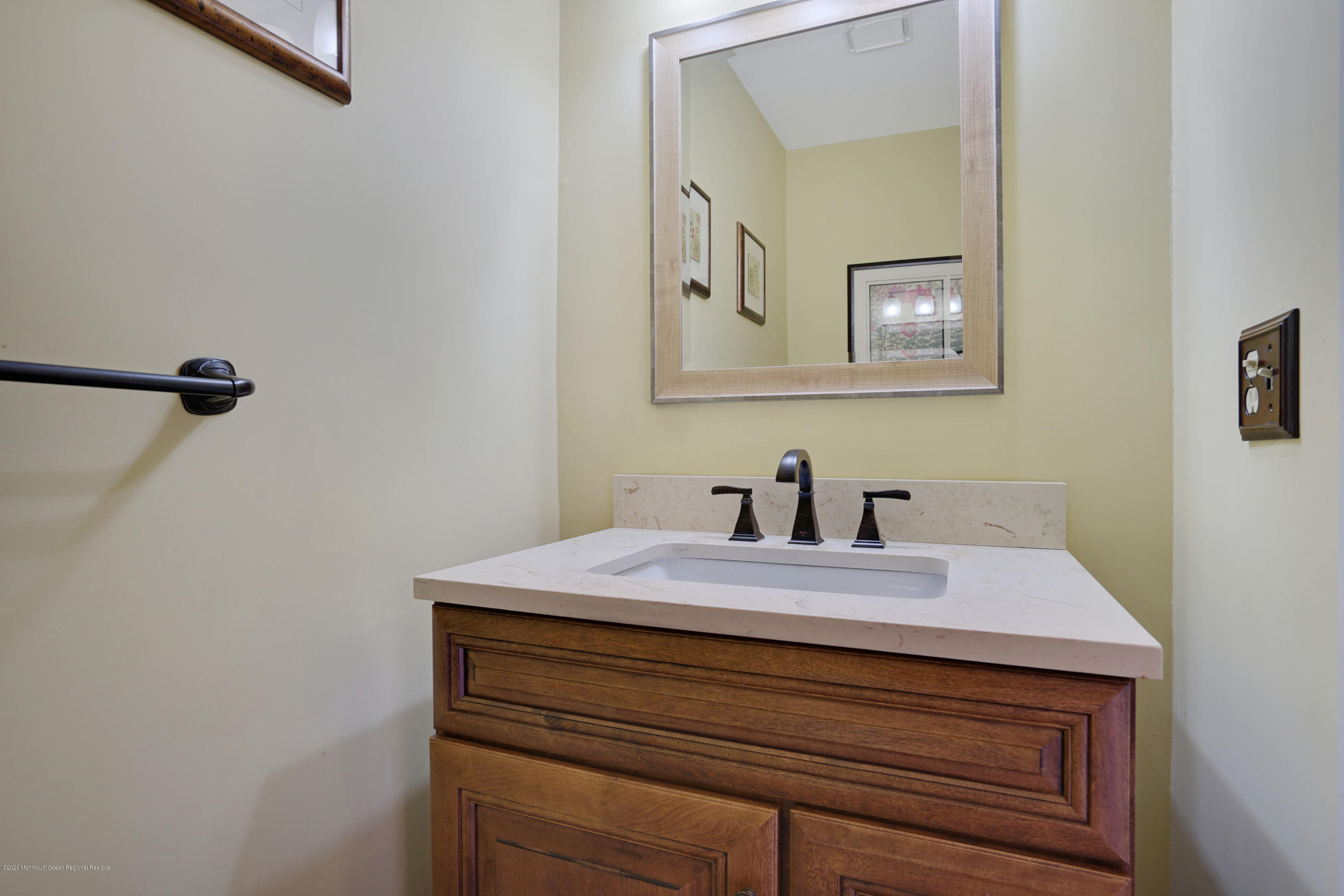 11 Metedeconk Road Brick, NJ 08723 - Photo 81 of 99 a bathroom with a sink vanity and a mirror