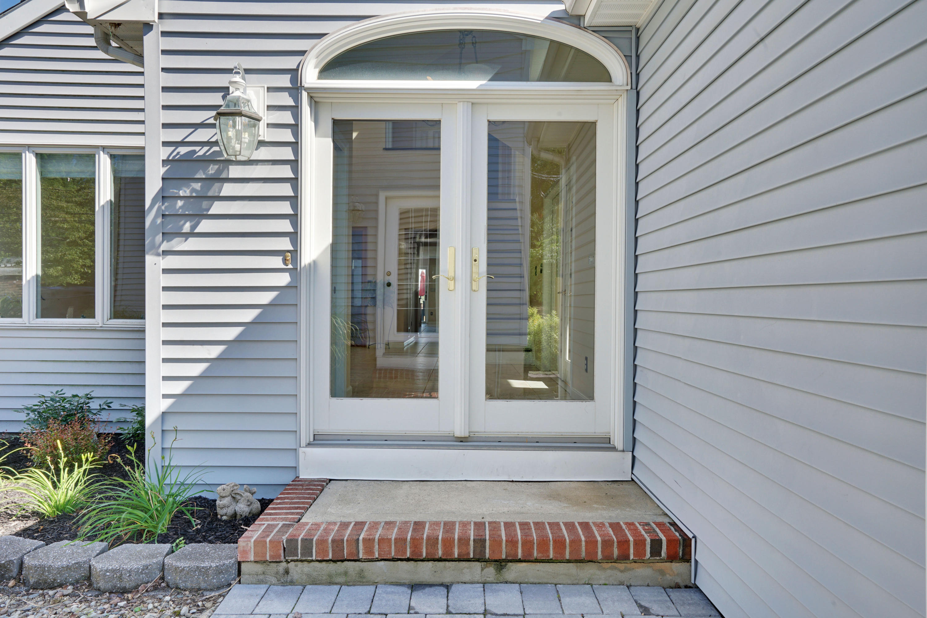 11 Metedeconk Road Brick, NJ 08723 - Photo 95 of 99 a view of a entryway door front of house