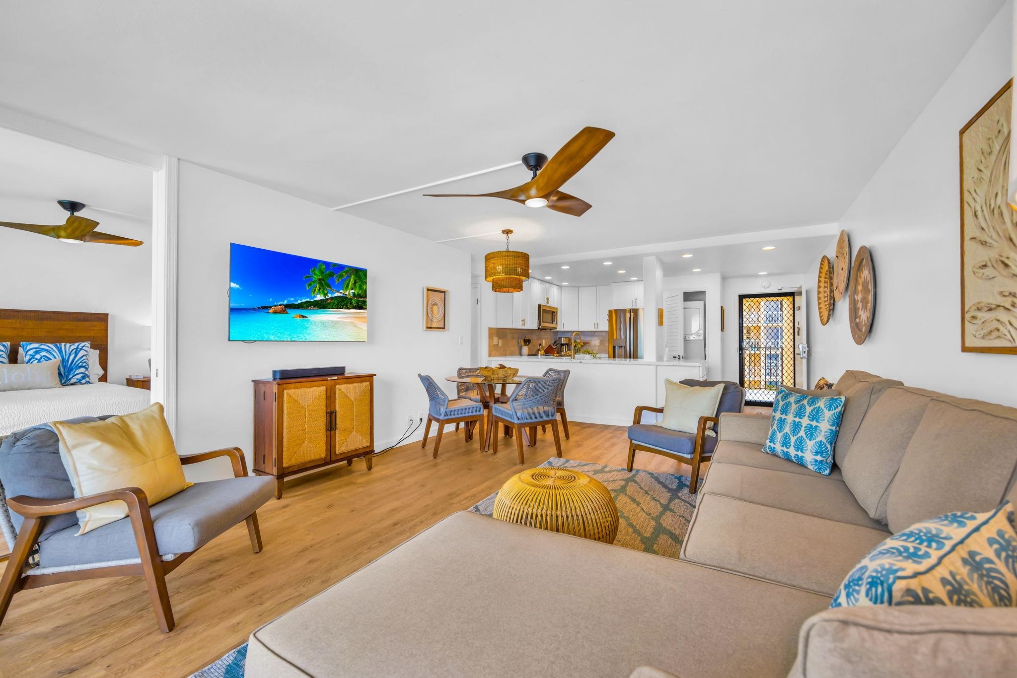 4401 Lower Honoapiilani Road, Unit B603 Lahaina, HI 96761 - Photo 12 of 41 a living room with furniture and a flat screen tv