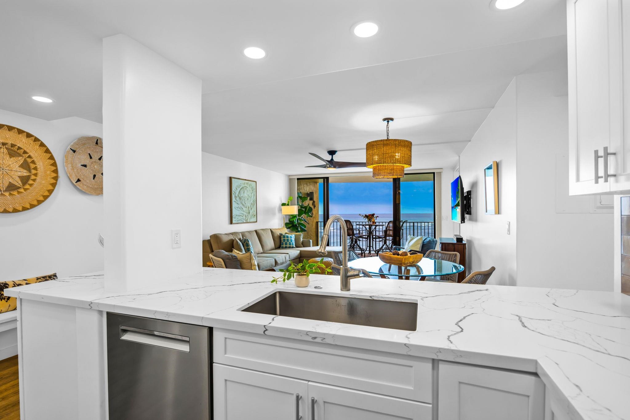 4401 Lower Honoapiilani Road, Unit B603 Lahaina, HI 96761 - Photo 14 of 41 a kitchen with a sink a stove and cabinets