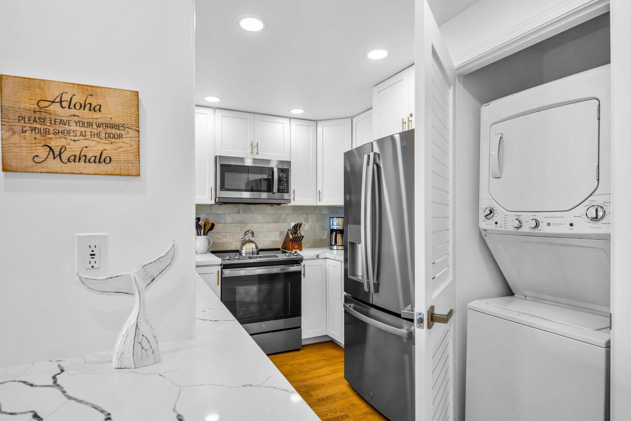 4401 Lower Honoapiilani Road, Unit B603 Lahaina, HI 96761 - Photo 16 of 41 a kitchen with stainless steel appliances a refrigerator sink and microwave