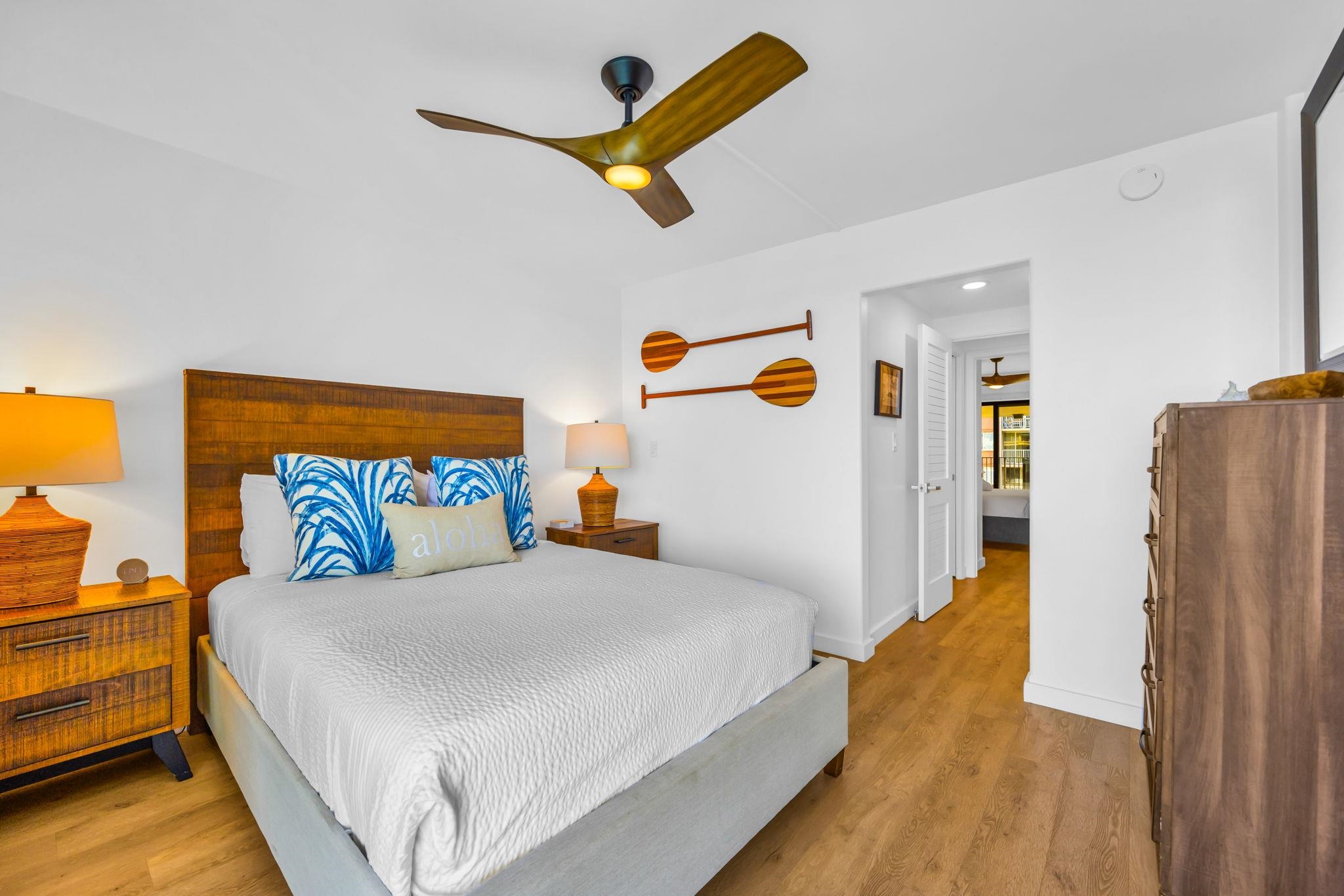 4401 Lower Honoapiilani Road, Unit B603 Lahaina, HI 96761 - Photo 20 of 41 a bedroom with a bed and wooden floor