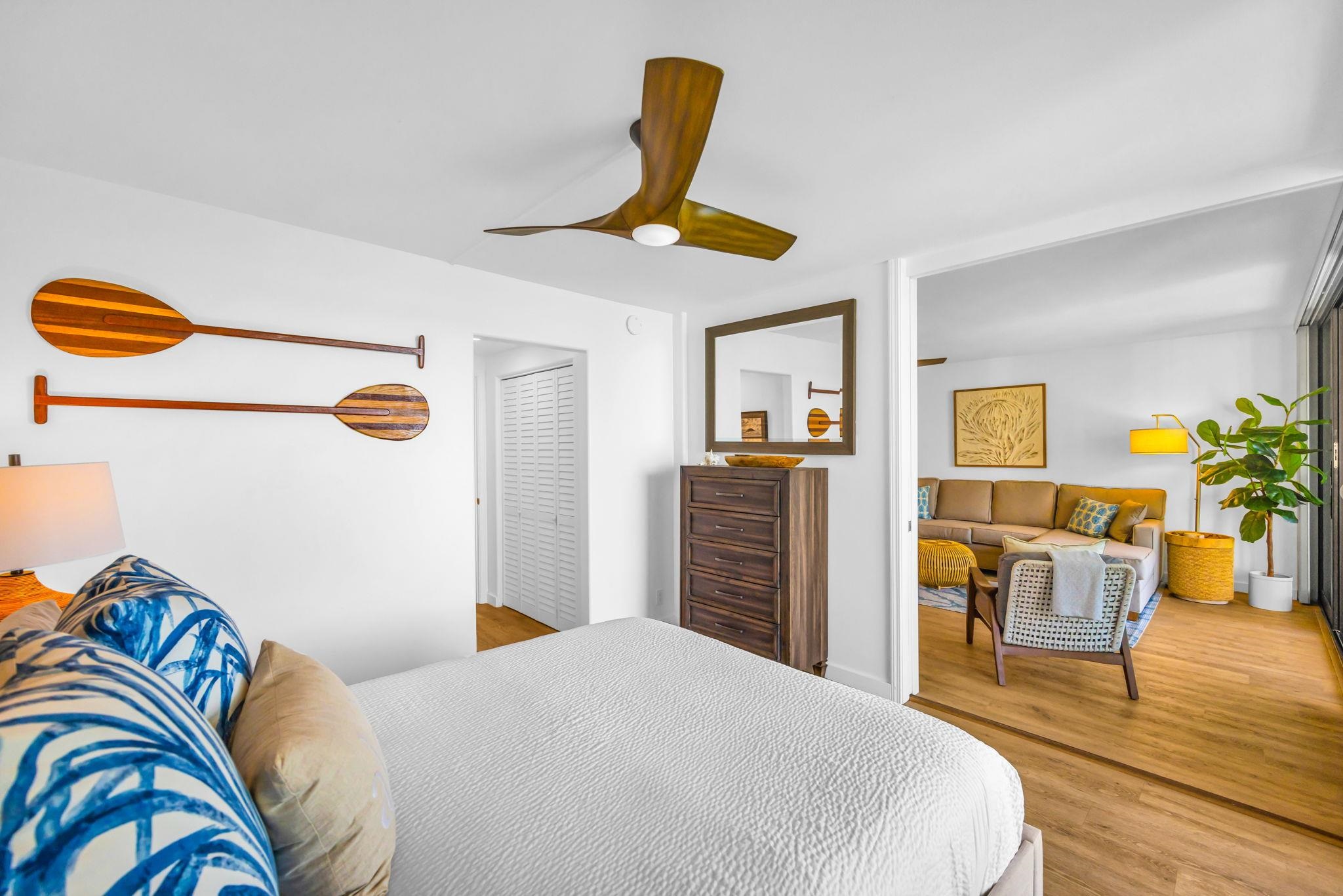 4401 Lower Honoapiilani Road, Unit B603 Lahaina, HI 96761 - Photo 21 of 41 a bedroom with a bed and wooden floor