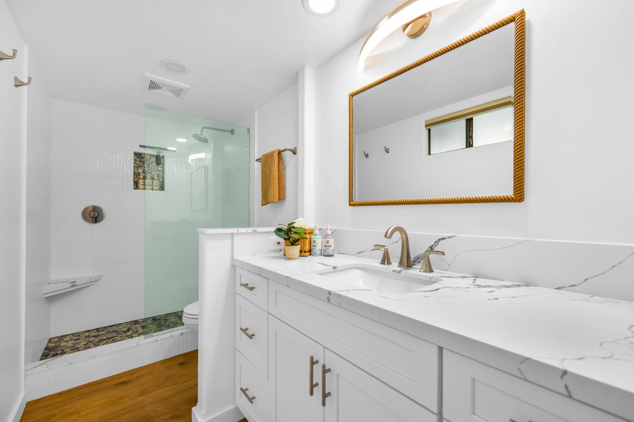 4401 Lower Honoapiilani Road, Unit B603 Lahaina, HI 96761 - Photo 22 of 41 a bathroom with a sink and a mirror