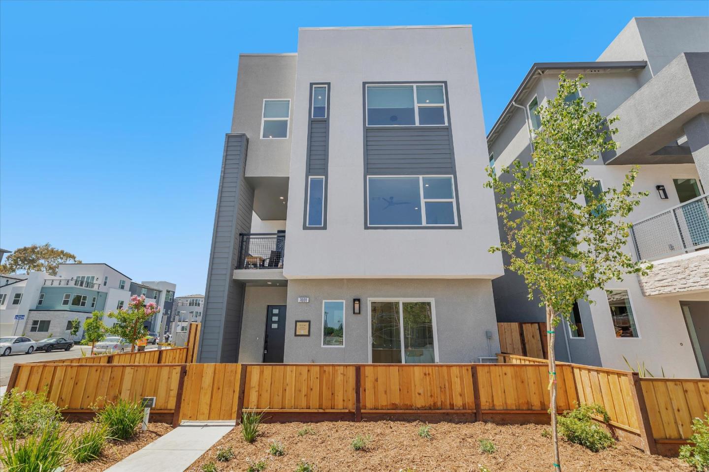 1029 Sinopia Terrace San Ramon, CA 94583 - Photo 1 of 1 a view of a brick building next to a yard