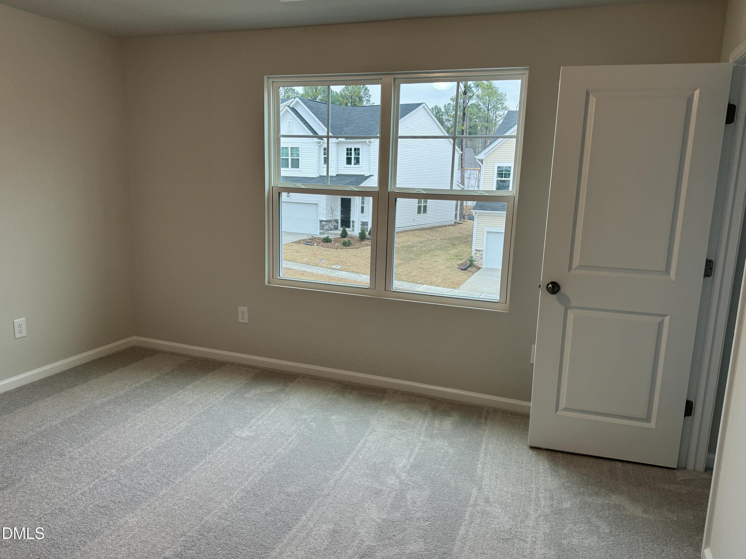 5706 Woodlawn Drive Durham, NC 27703 - Photo 13 of 20 an empty room with a window