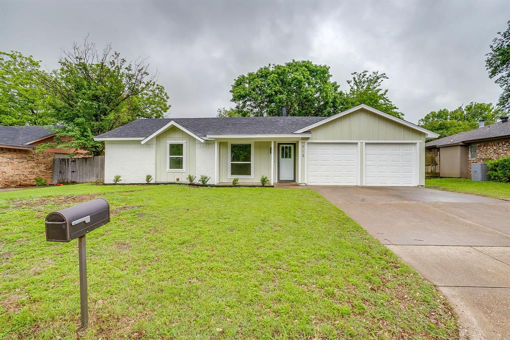 713 Vaughn Drive Burleson, TX 76028 - Photo 2 of 40 a front view of house with yard and green space