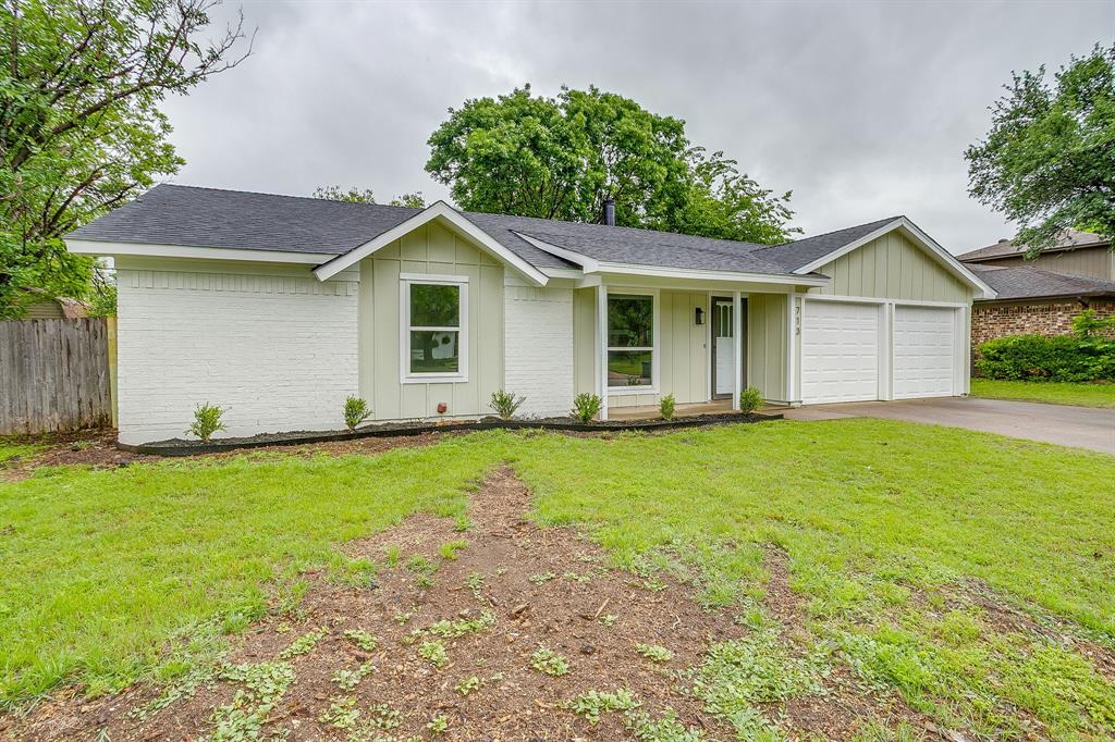 713 Vaughn Drive Burleson, TX 76028 - Photo 3 of 40 a house with a garden