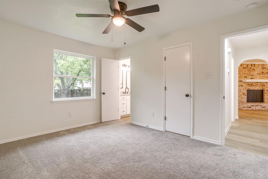 713 Vaughn Drive Burleson, TX 76028 - Photo 32 of 40 an empty room with fan and windows