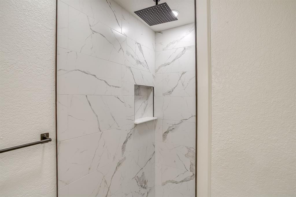 713 Vaughn Drive Burleson, TX 76028 - Photo 37 of 40 a bathroom with a shower