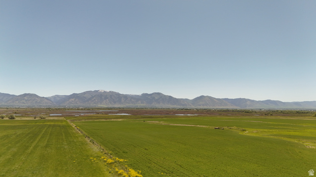 320 South 5400 West Logan, UT 84321 - Photo 10 of 42 Expansive agricultural fields under a clear sky