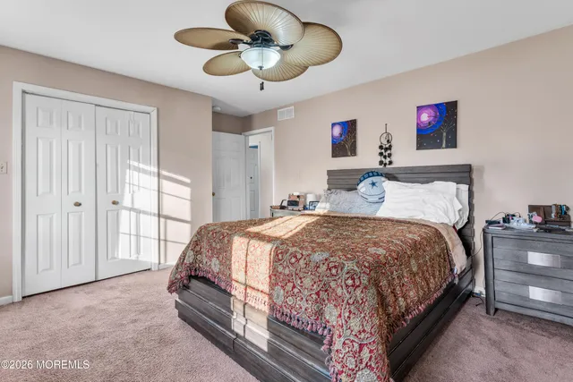 a bedroom with bed and window