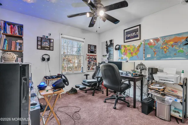 a view of a workspace with furniture and toys