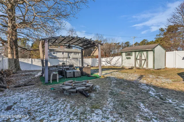 a view of a house with a yard and pathway