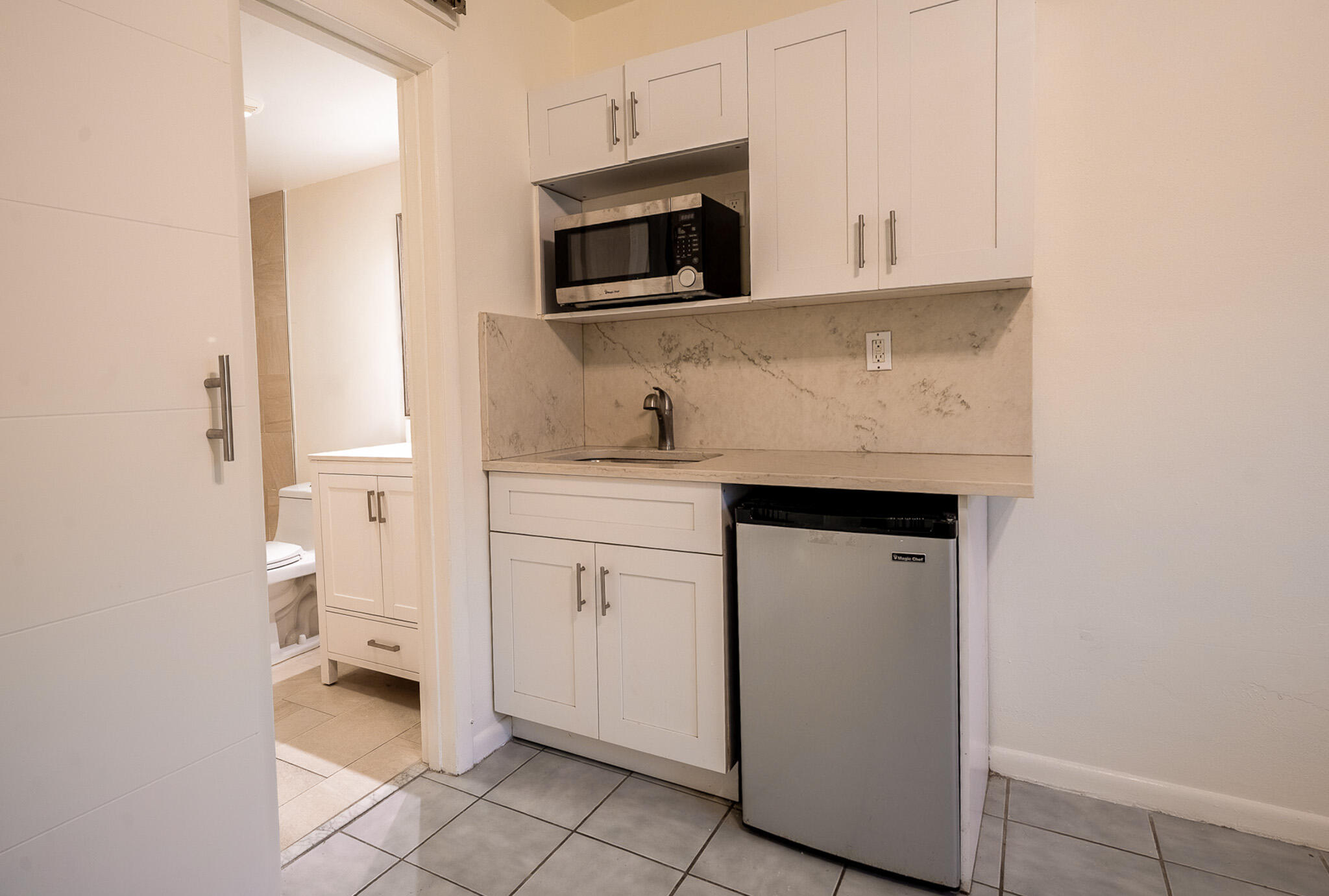 1129 Pebble Beach Lane, Unit 11 Marathon, FL 33050 - Photo 13 of 15 a kitchen with a sink and a stove top oven