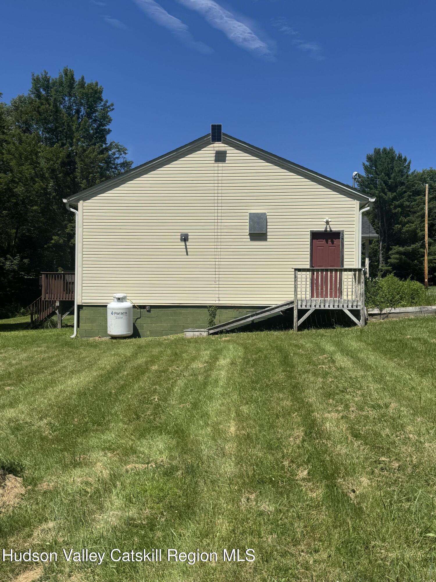 66-84 Katzman Road Ellenville, NY 12428 - Photo 2 of 30 a view of a backyard with a garden